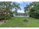 Backyard view of home with pergola and firepit at 4430 14Th N Ave, St Petersburg, FL 33713