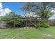 Wooden pergola with benches in a garden setting at 4430 14Th N Ave, St Petersburg, FL 33713