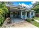 Light blue house with carport and walkway at 4430 14Th N Ave, St Petersburg, FL 33713