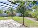 Landscaped backyard with a shed, patio, and plenty of green space at 5210 Newton S Ave, Gulfport, FL 33707