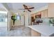 Well-lit kitchen features modern appliances, tile floors, and ample counter space, perfect for cooking and entertaining at 5210 Newton S Ave, Gulfport, FL 33707