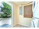 Laundry area with stackable washer and dryer near backyard access at 5210 Newton S Ave, Gulfport, FL 33707