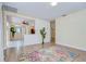 Spacious living area with wood floors, fresh paint, open layout, connecting to the kitchen, and stylish accents at 5210 Newton S Ave, Gulfport, FL 33707