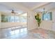 Bright living room with multiple windows, and decorative rug on tile floor at 5210 Newton S Ave, Gulfport, FL 33707
