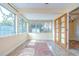 Bright sunroom with multiple windows, adjacent to indoor space at 5210 Newton S Ave, Gulfport, FL 33707