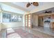 View of sunroom featuring tile flooring and many windows, leading to the kitchen at 5210 Newton S Ave, Gulfport, FL 33707