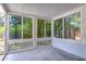 Bright sunroom with large sliding windows offering views of the greenery at 5210 Newton S Ave, Gulfport, FL 33707