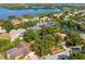 Stunning aerial view of a lakeside community with lush greenery, offering a serene and picturesque neighborhood setting at 5841 Bay Pines Lakes Blvd, St Petersburg, FL 33708