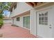 Backyard with wooden porch with white door frame at 5841 Bay Pines Lakes Blvd, St Petersburg, FL 33708