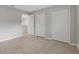 Bedroom with laminate flooring, two large closets, and neutral paint at 5841 Bay Pines Lakes Blvd, St Petersburg, FL 33708