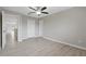 Bedroom featuring wood-look floors, ceiling fan, and closet at 5841 Bay Pines Lakes Blvd, St Petersburg, FL 33708