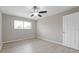 Bedroom featuring wood-look floors, ceiling fan, and closet at 5841 Bay Pines Lakes Blvd, St Petersburg, FL 33708