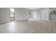 Spacious bedroom with laminate flooring, neutral paint and natural light at 5841 Bay Pines Lakes Blvd, St Petersburg, FL 33708