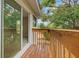 Wood deck overlooking lush backyard, perfect for outdoor relaxing at 5841 Bay Pines Lakes Blvd, St Petersburg, FL 33708