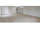 Spacious living room featuring wood-look floors, neutral paint, and a view of the upstairs hallway at 5841 Bay Pines Lakes Blvd, St Petersburg, FL 33708