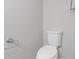 Toilet with silver flush handle; silver toilet paper holder at 5841 Bay Pines Lakes Blvd, St Petersburg, FL 33708
