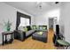 Cozy living area with a plush sectional sofa, ottoman, and stylish decor at 7787 39Th N Ter # 7787, St Petersburg, FL 33709