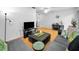 Bright living room with a large sectional sofa and a view into dining area at 7787 39Th N Ter # 7787, St Petersburg, FL 33709