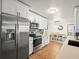 Modern kitchen with stainless steel appliances and white shaker cabinets at 1943 Jeffords St, Clearwater, FL 33764