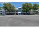 Two-story building with multiple units, ample parking, and mature landscaping at 2599 Dolly Bay Dr # 308, Palm Harbor, FL 34684