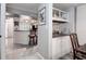 Kitchen with breakfast bar, granite counters, and white cabinets at 2599 Dolly Bay Dr # 308, Palm Harbor, FL 34684