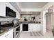 Kitchen with stainless steel appliances and white cabinets at 2599 Dolly Bay Dr # 308, Palm Harbor, FL 34684