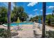 Inviting community pool area with lake access at 2599 Dolly Bay Dr # 308, Palm Harbor, FL 34684