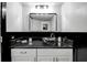 Modern bathroom with black and white vanity and glass sink at 2599 Dolly Bay Dr # 308, Palm Harbor, FL 34684