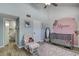 Bright Bedroom with rocking chair and adjacent bathroom at 2599 Dolly Bay Dr # 308, Palm Harbor, FL 34684