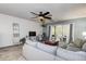 Living area features a gray sectional and wood floors at 2599 Dolly Bay Dr # 308, Palm Harbor, FL 34684