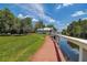 Scenic boardwalk leads to waterfront with dock access at 2599 Dolly Bay Dr # 308, Palm Harbor, FL 34684