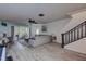 Spacious living room with gray sectional sofa and wood floors at 2599 Dolly Bay Dr # 308, Palm Harbor, FL 34684