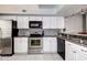 Kitchen with stainless steel appliances and granite countertops at 2599 Dolly Bay Dr # 308, Palm Harbor, FL 34684