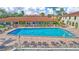 Community pool with plenty of lounge chairs at 19029 Us Highway 19 N # 12B, Clearwater, FL 33764