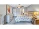 Primary bedroom with ceiling fan, dresser, and access to patio at 19029 Us Highway 19 N # 12B, Clearwater, FL 33764