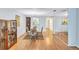 Bright dining area featuring hardwood floors and built-in shelving at 19029 Us Highway 19 N # 12B, Clearwater, FL 33764