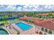 Community pool with surrounding lounge chairs and patio area at 19029 Us Highway 19 N # 12B, Clearwater, FL 33764