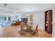 Dining room with glass table, wicker chairs, and hardwood floors at 19029 Us Highway 19 N # 12B, Clearwater, FL 33764