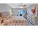 Spacious Primary bedroom with private patio access and ceiling fan at 19029 Us Highway 19 N # 12B, Clearwater, FL 33764