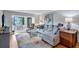 Bright living room featuring comfortable seating and wood floors at 19029 Us Highway 19 N # 12B, Clearwater, FL 33764
