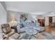 Spacious living room with sectional sofa and hardwood floors at 19029 Us Highway 19 N # 12B, Clearwater, FL 33764