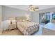 Main bedroom with sliding doors to private patio at 19029 Us Highway 19 N # 12B, Clearwater, FL 33764