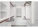 Spacious walk-in closet with ample shelving and hanging rods at 19029 Us Highway 19 N # 12B, Clearwater, FL 33764