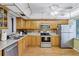 Kitchen with wood cabinets, stainless steel appliances at 19029 Us Highway 19 N # 12B, Clearwater, FL 33764