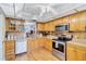 Kitchen with wood cabinets and stainless steel appliances at 19029 Us Highway 19 N # 12B, Clearwater, FL 33764