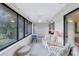 Sunroom with view of garden and comfortable wicker furniture at 19029 Us Highway 19 N # 12B, Clearwater, FL 33764
