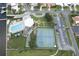 Community pool, tennis courts, and parking visible from above at 10216 Regal Dr # 708, Largo, FL 33774