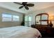 Main bedroom with a king-size bed and access to a balcony at 10216 Regal Dr # 708, Largo, FL 33774