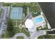 Aerial view showing resort-style amenities including pool, tennis courts, and ample parking at 10216 Regal Dr # 708, Largo, FL 33774