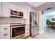 Modern kitchen with stainless steel appliances and white cabinets at 10216 Regal Dr # 708, Largo, FL 33774